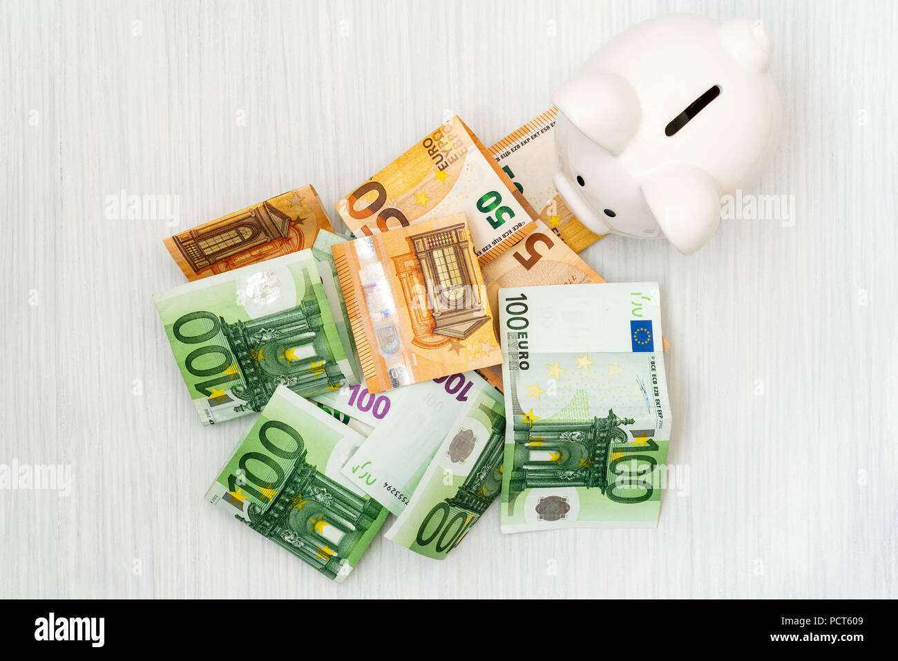 Piggy Bank and Euro banknotes.Top view Stock Photo - Alamy