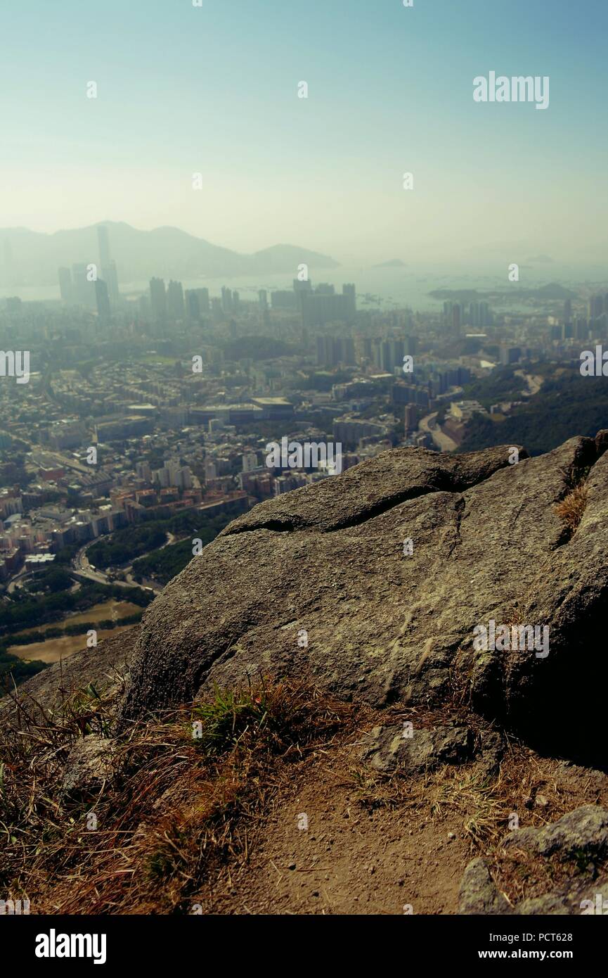 City view of Hong-Kong from the Lion Rock after a hike. Stock Photo