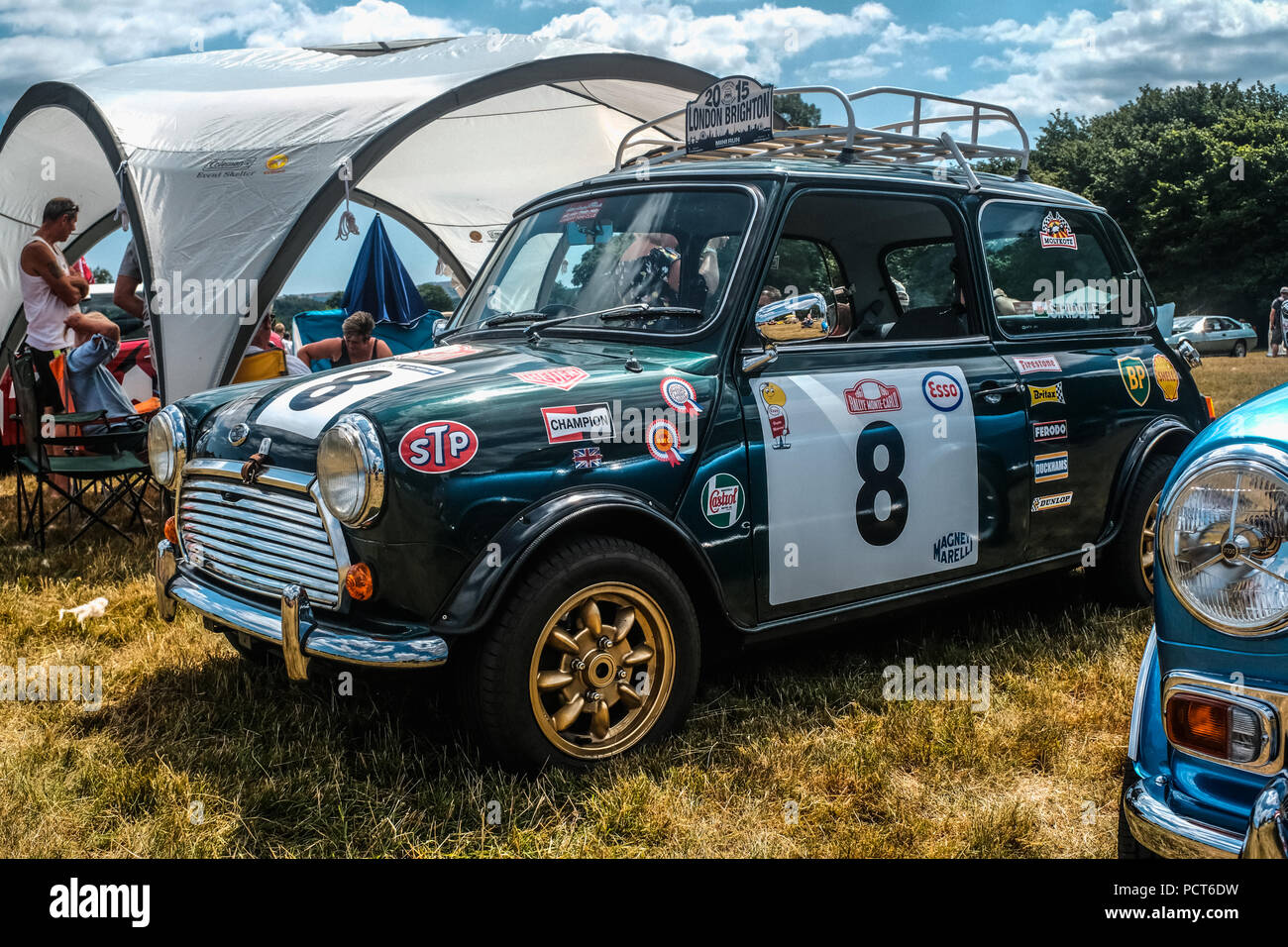Family day out at a classic car show held at the historic manor house