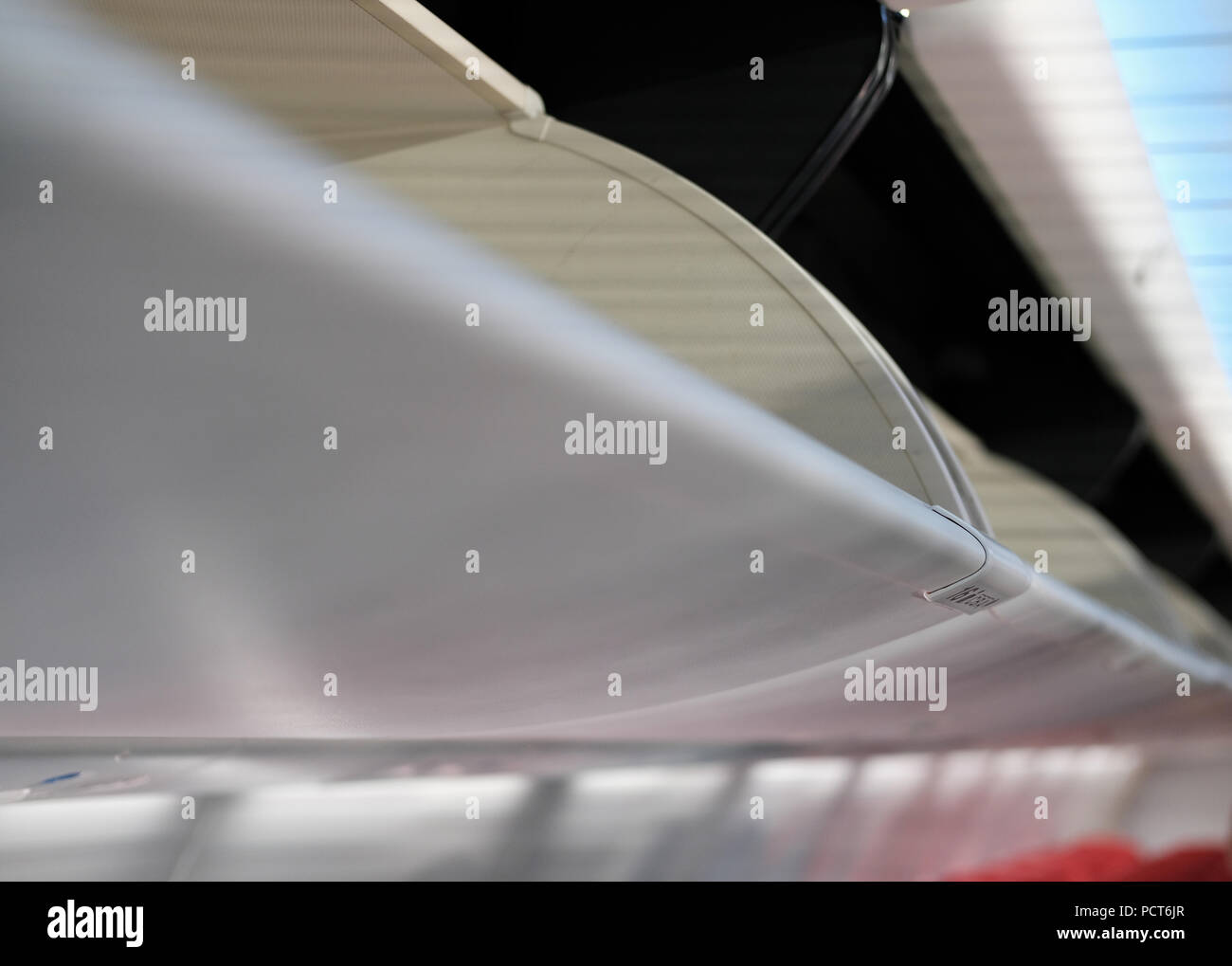 overhead baggage compartment in airplane. aircraft cabin interior Stock