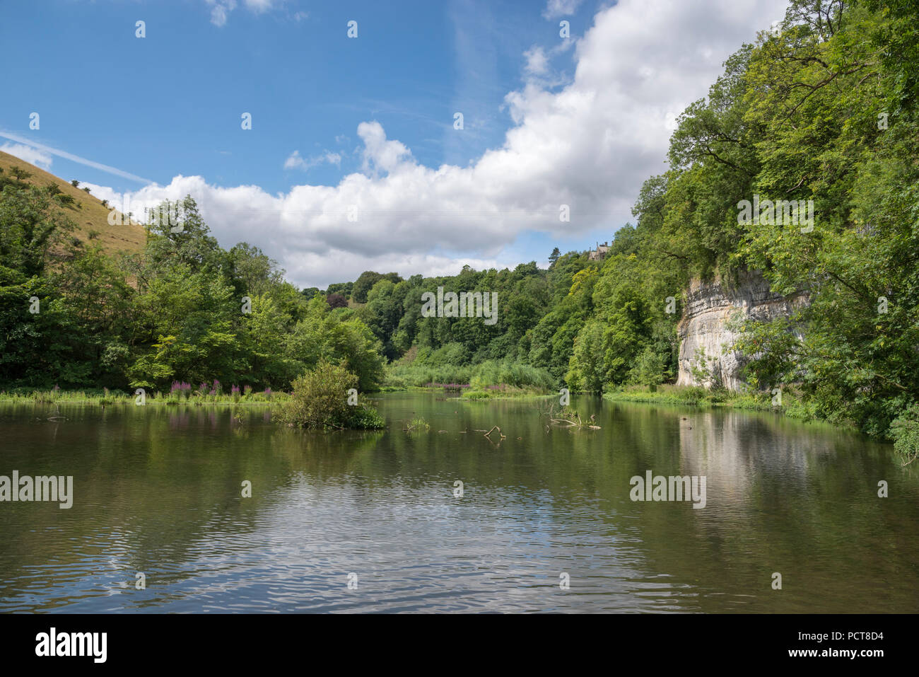 Beautiful summer day beside the river Wye at WatercumJolly Dale in