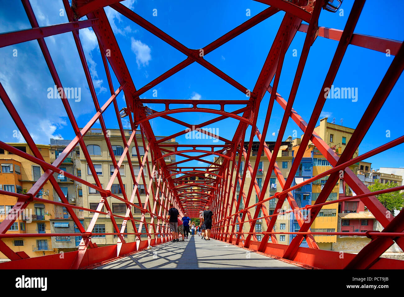 Red bridge over Onyar River built by Eiffel company, Cataluña, Gerona, Stock Photo