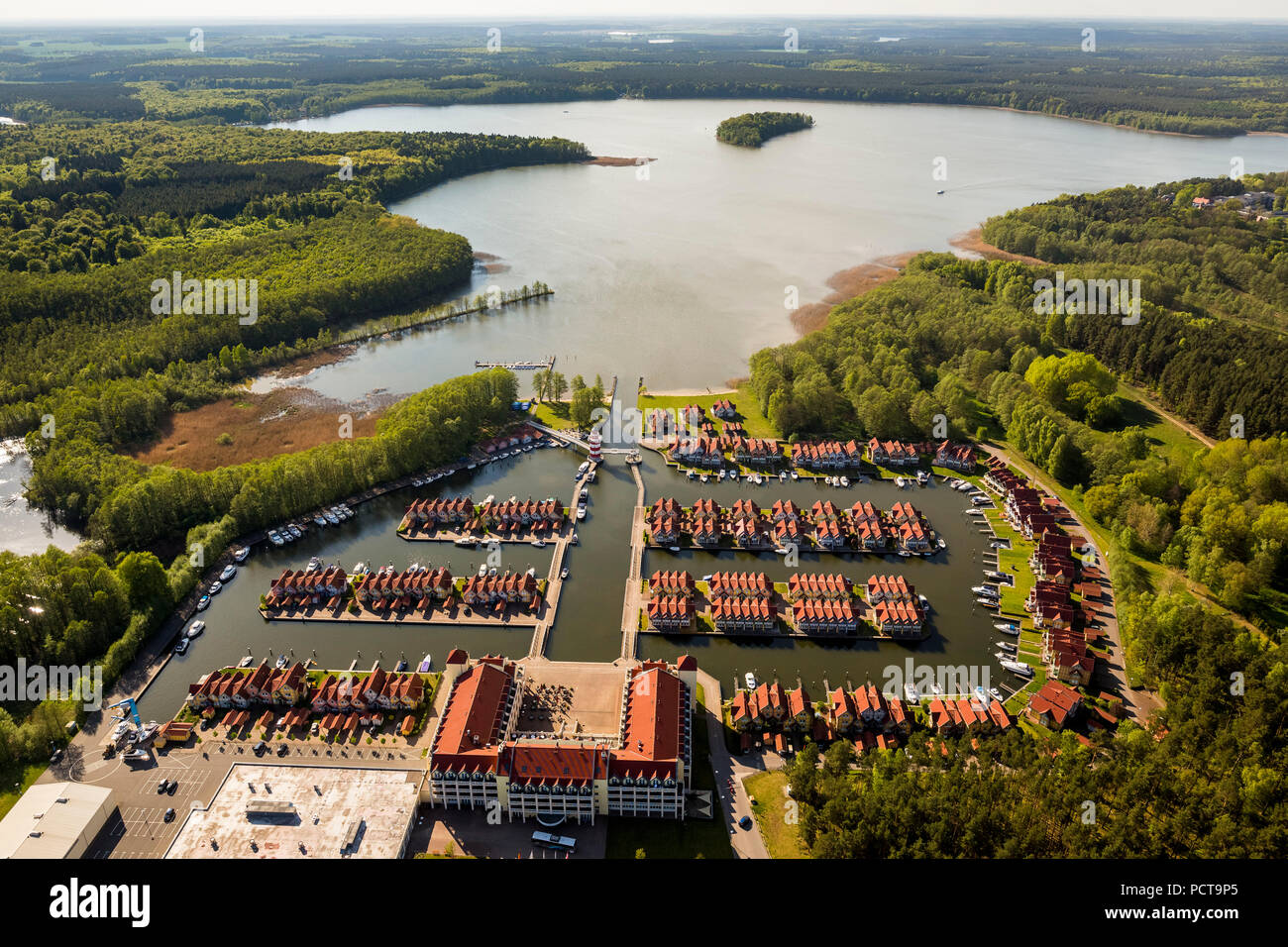 Rheinsberg Marina, Hafendorf Rheinsberg, harbour houses, holiday homes with landing stages on Lake 'Großer Rheinsberger See', Rheinsberg, Mecklenburg Lake Plateau, Brandenburg, Germany Stock Photo
