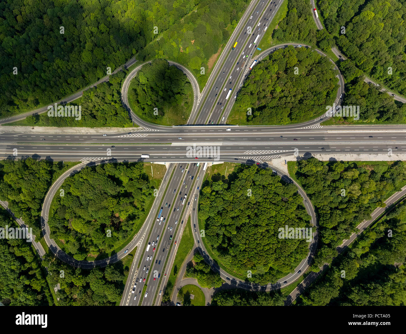 Autobahnkreuz Oberhause interchange, A2 and A3 Autobahnen (motorways), cloverleaf-shaped, forest, Oberhausen, Ruhr area Stock Photo