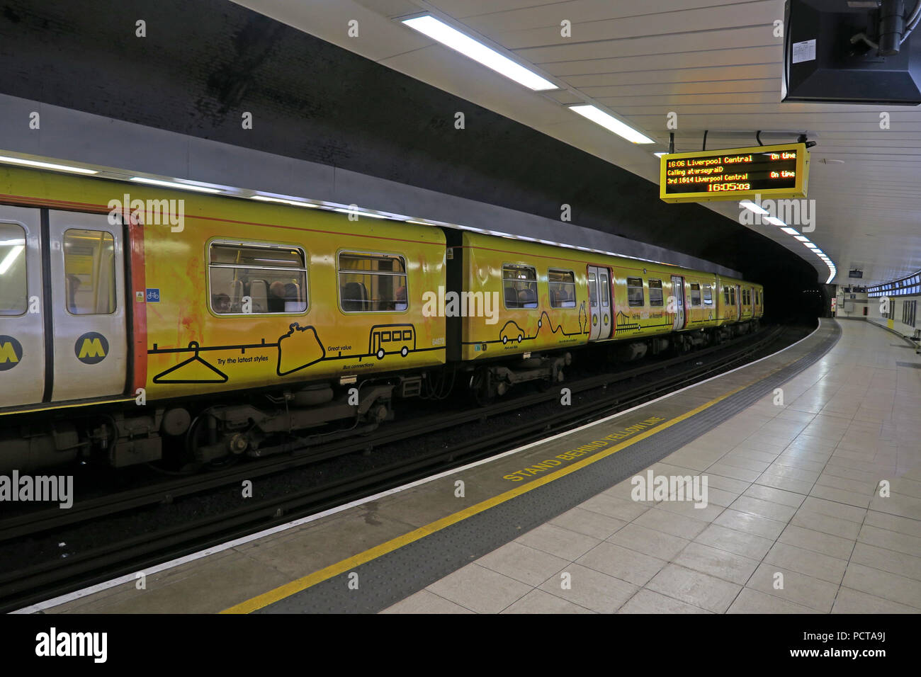 Yellow Merseyrail, Liverpool EMU underground train, at Birkenhead Hamilton Square Railway Station, Merseyside, North West England, UK Stock Photo