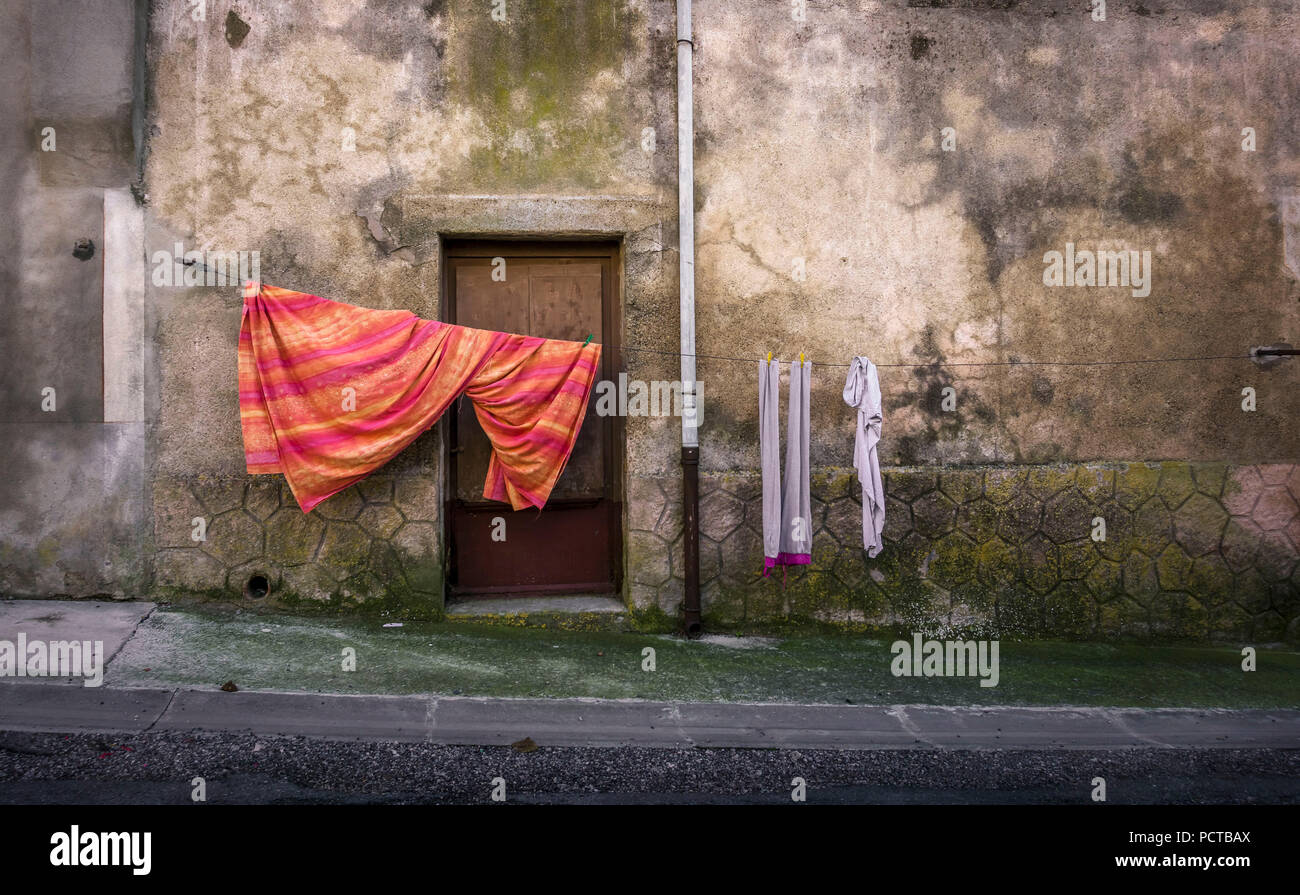 Clothesline in front of old house facade Stock Photo