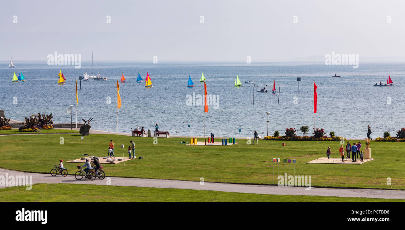 Switzerland, Canton Thurgau, Lake Constance, Arbon, lake promenade, park, cyclists, playground, sailing boats Stock Photo