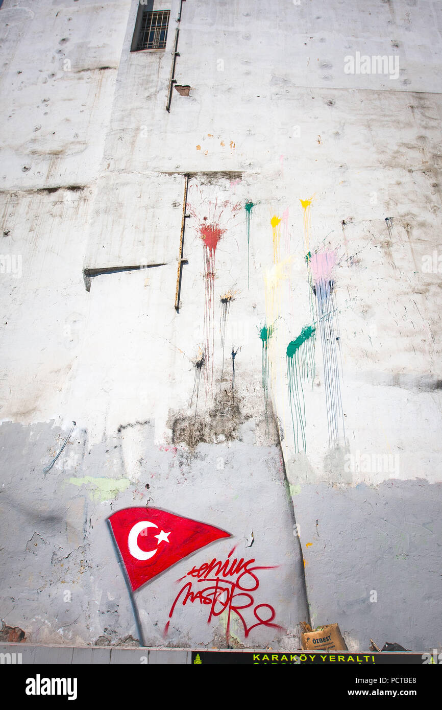 Graffiti, house wall with Turkish flag and spots of paint Stock Photo