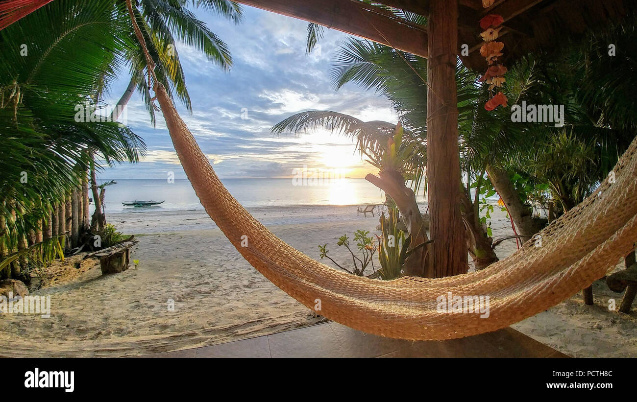 Philippines, hammock on the beach, sunset Stock Photo Alamy