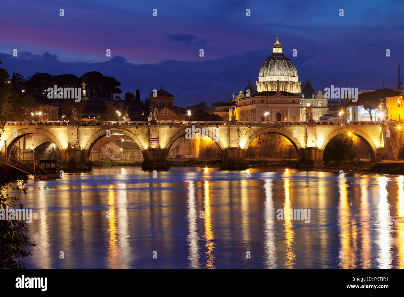View over the Tiber to the Ponte Vittorio Emanuele II and St. Peter's Basilica, Rome, Lazio, Italy Stock Photo