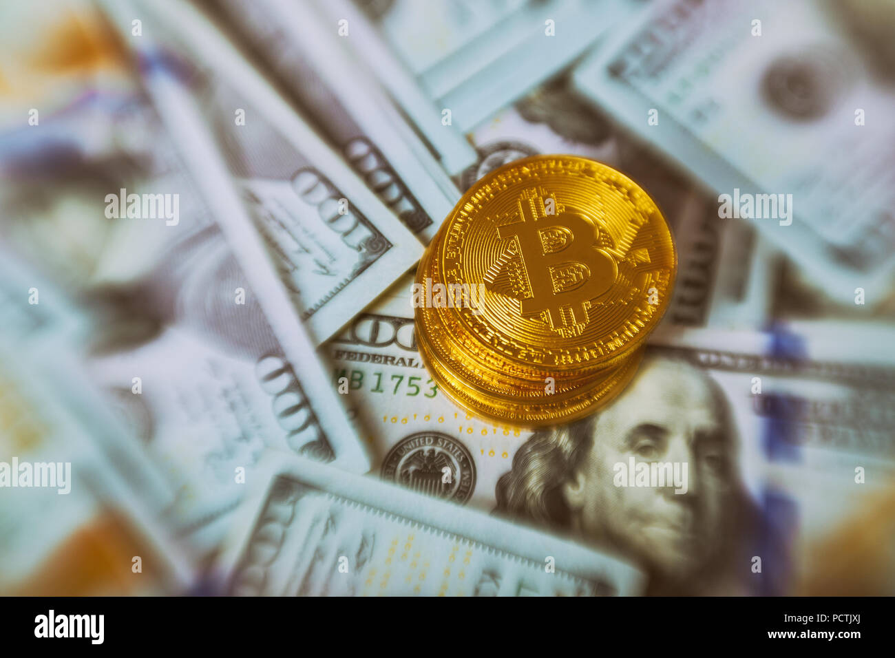 Golden Bitcoins on US dollars for background digital currency close-up. New Virtual money concept. cryptocurrency and worldwide payment system Stock Photo