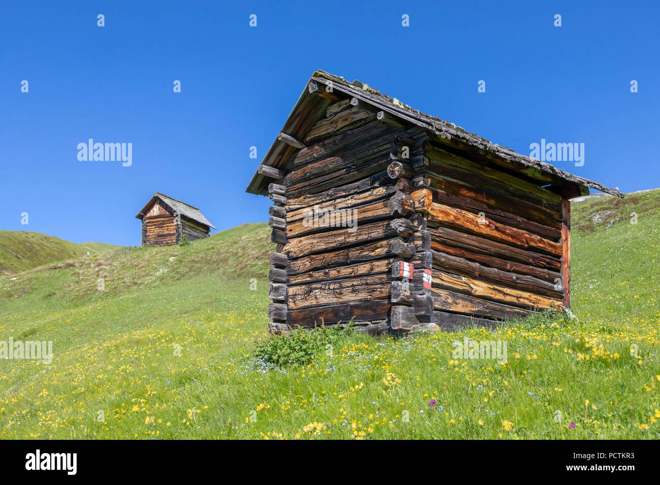 old wooden huts built with the old system Blockbau, Puez-Geisler Nature Park, Dolomites, San Martin de Tor, Bolzano, South Tyrol, Italy Stock Photo