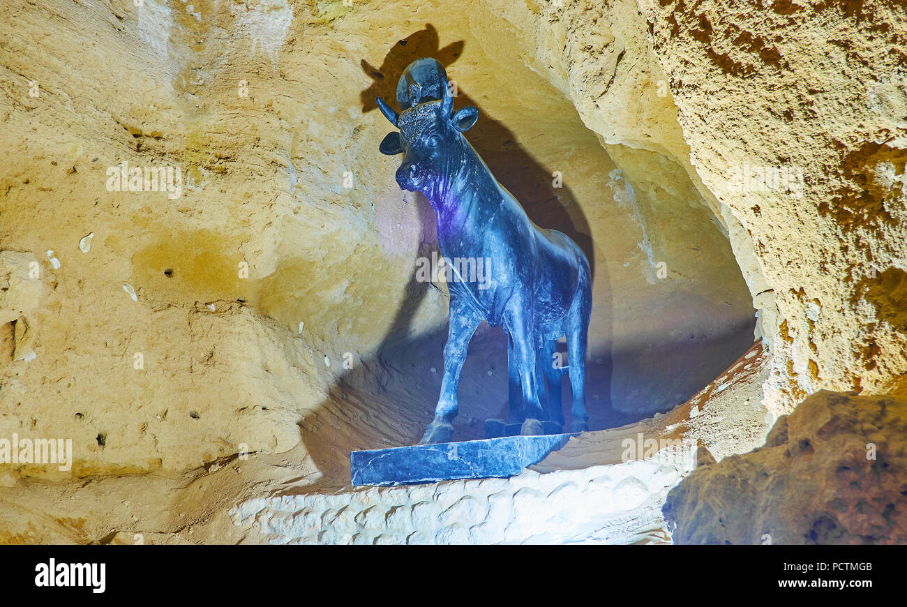 ALEXANDRIA, EGYPT - DECEMBER 18, 2017: The statue of sacred Apis bull in catacombs of Serapeum Temple, Amoud Al Sawari archaeological site, on Decembe Stock Photo