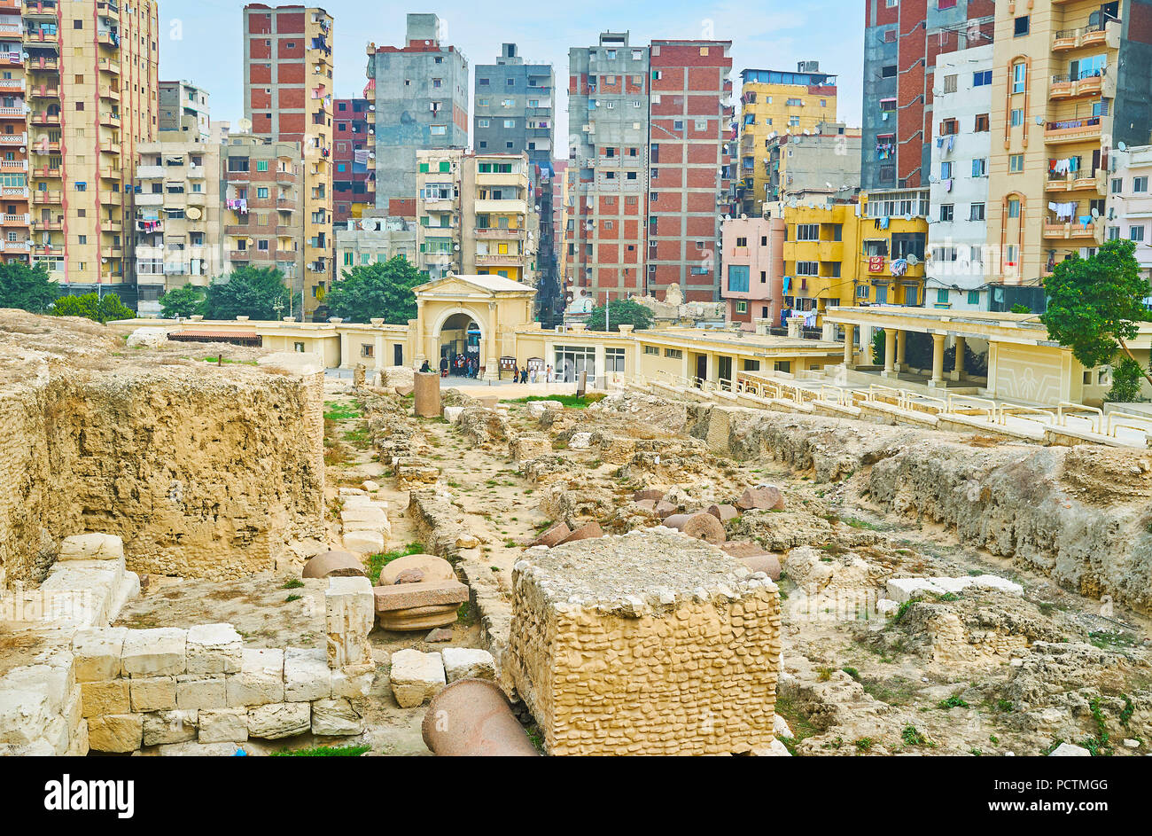 The view of Amoud Al Sawari archaeological site with preserved foundation of Serapeum Temple and main entrance gate on background, Alexandria, Egypt. Stock Photo