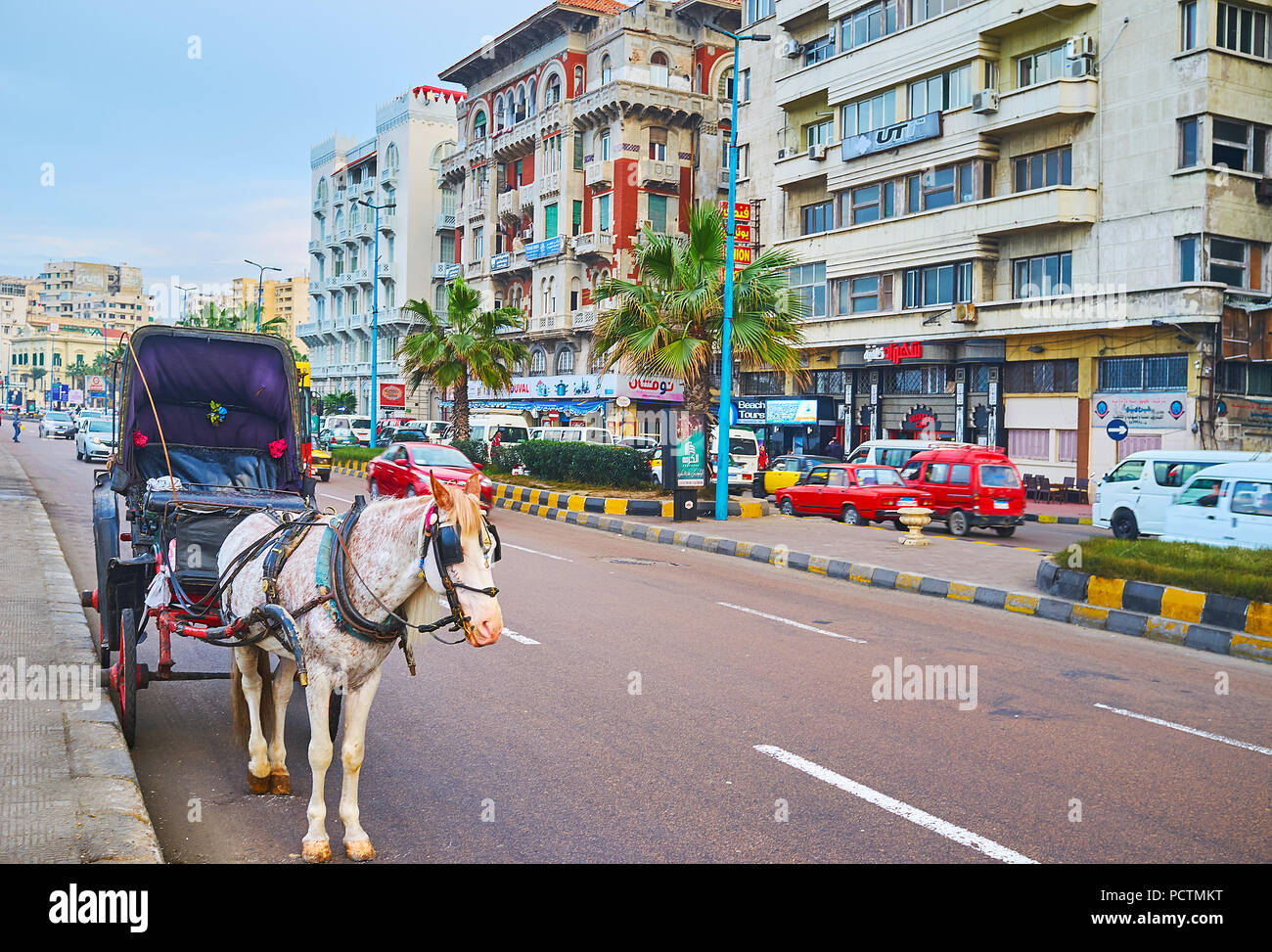 ALEXANDRIA, EGYPT - DECEMBER 18, 2017: The horse-drawn carriages are popular tourist attraction in city, the standard route stretches along the Cornic Stock Photo