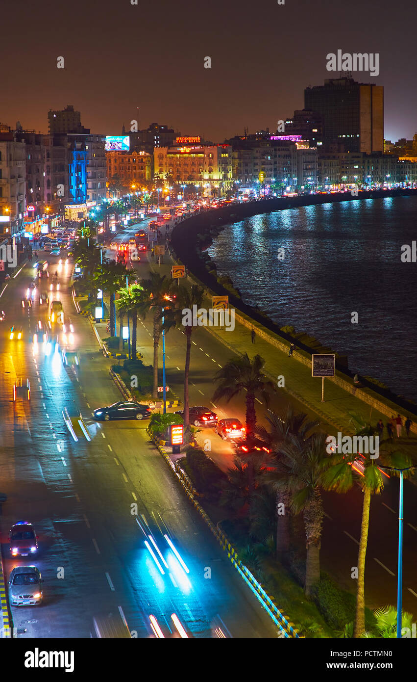 ALEXANDRIA, EGYPT - DECEMBER 18, 2017: The evening traffic along the Corniche Avenue, facing the coastline of the city, on December 18 in Alexandria. Stock Photo