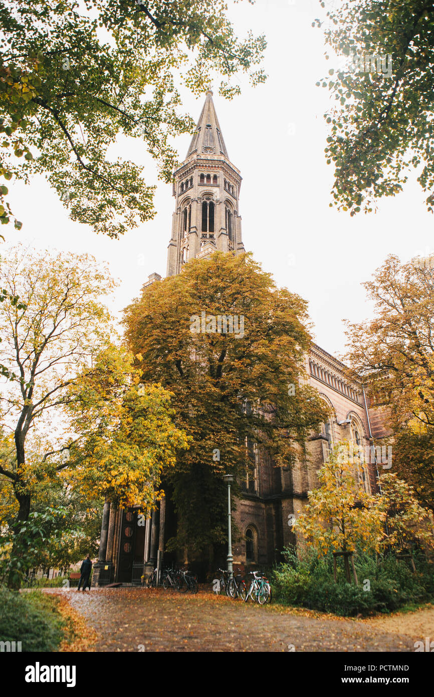 The church in Berlin in Germany in the autumn among the trees. A religious building. Stock Photo