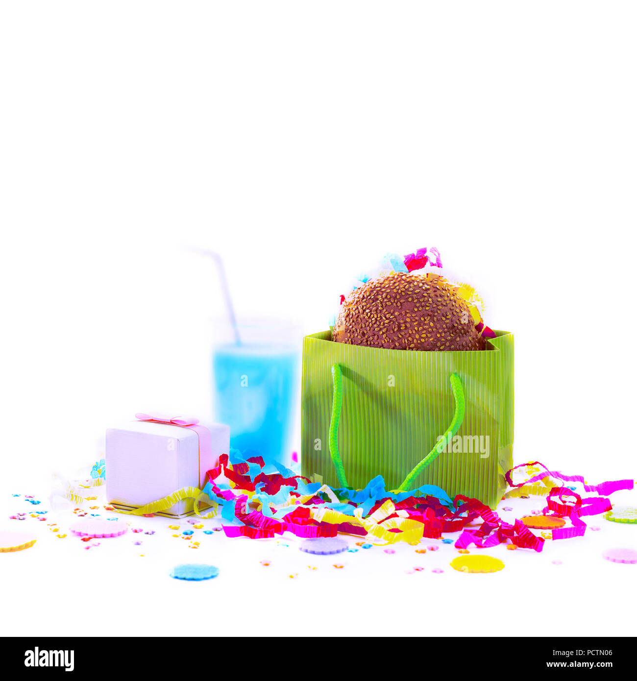 Surrealism Festive composition drinks snacks holiday hamburger cookie tinsel confetti gift box cocktail saturated colors. Children's holiday birthday  Stock Photo