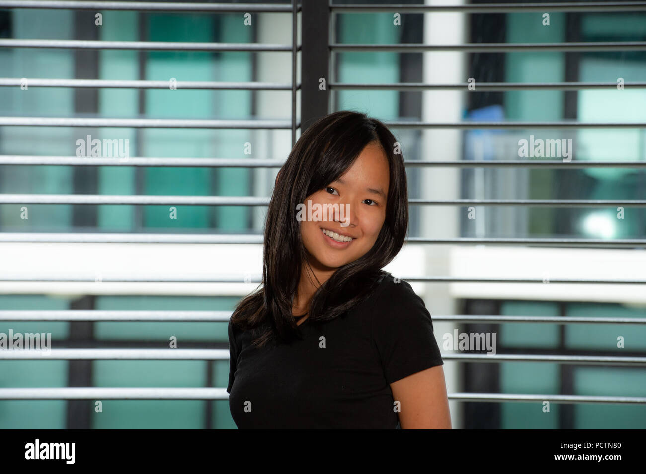 Beauty portrait of asian woman in a black shirt and white jean shorts Stock Photo