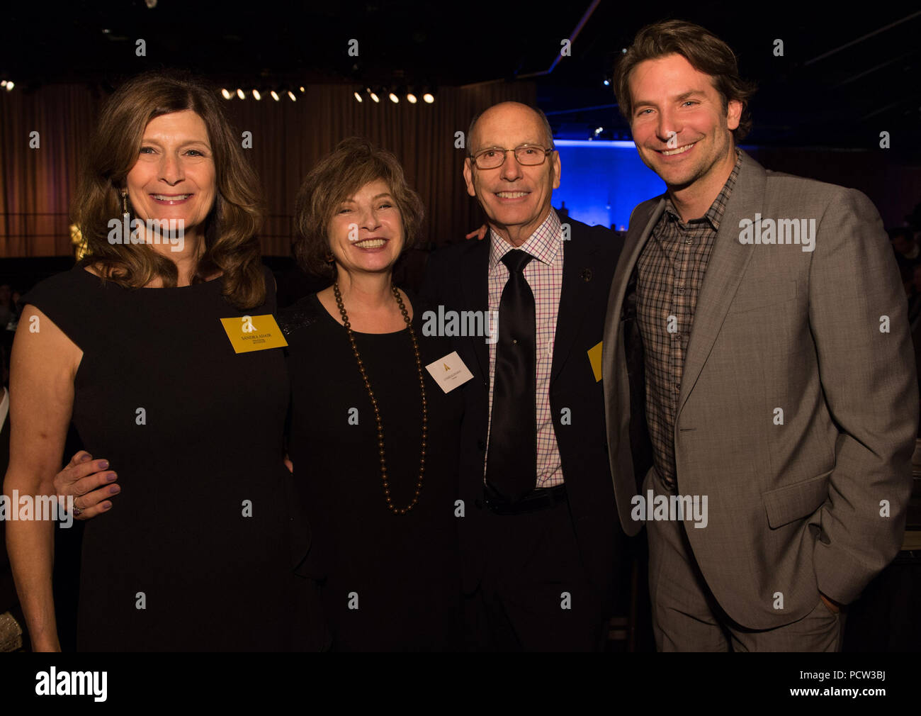 HOLLYWOOD, CA - FEBRUARY 02: Nominees Luncheon at the Beverly Hilton, February 2, 2015 for the 87th Oscars for outstanding film achievements of 2014 which will be presented on Sunday, February 22, 2015, at the Dolby Theatre and televised live by the ABC Television Network on February 22, 2015 in Hollywood, California.    People:  Sandra Adair, Academy Governor Lynzee Klingman, Joel Cox, Bradley Cooper Stock Photo