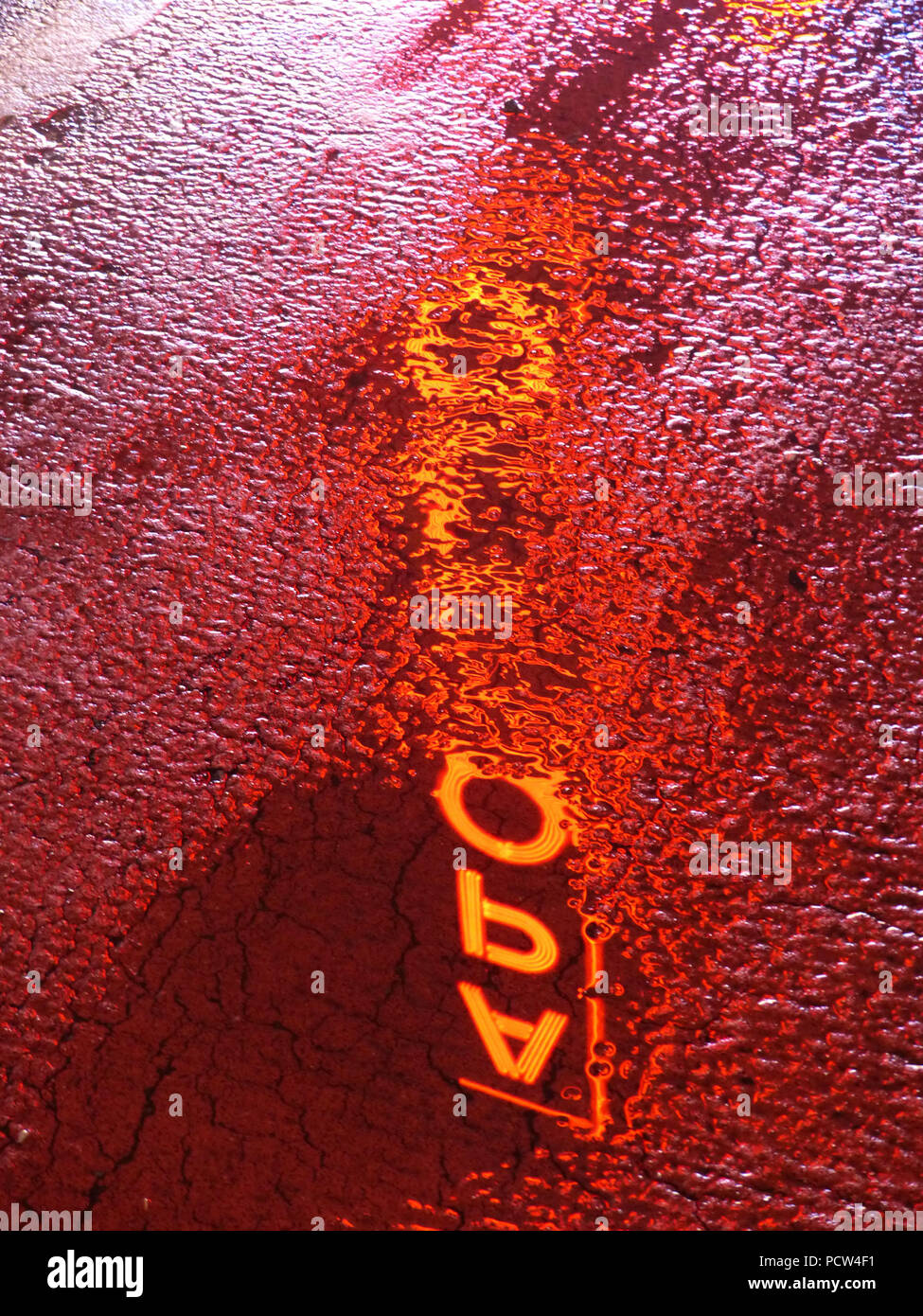 Water reflection in a puddle, Apollo Theater neon sign Stock Photo
