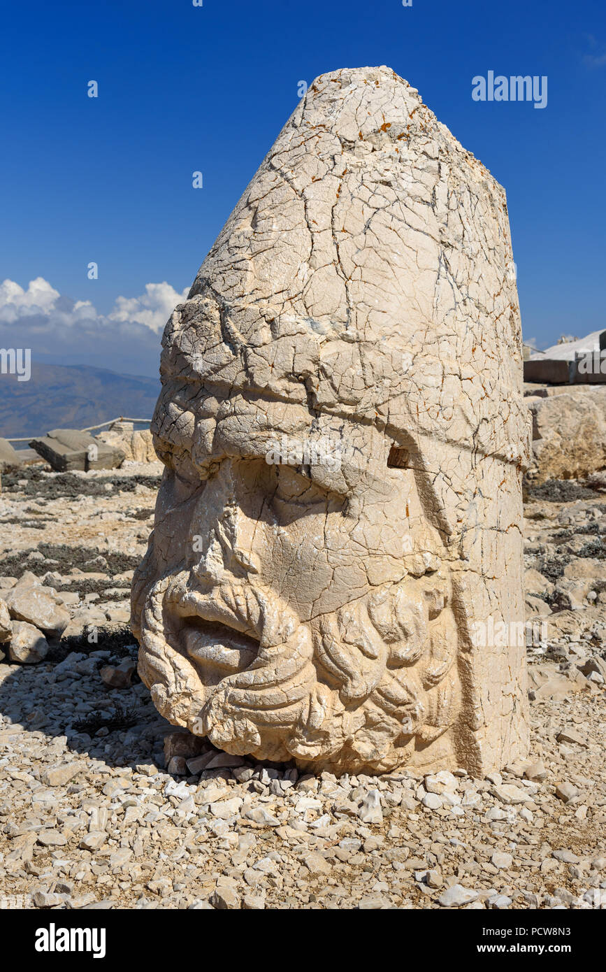 Zeus statue at West Terrace on top of Nemrut Mountain. Stone heads at
