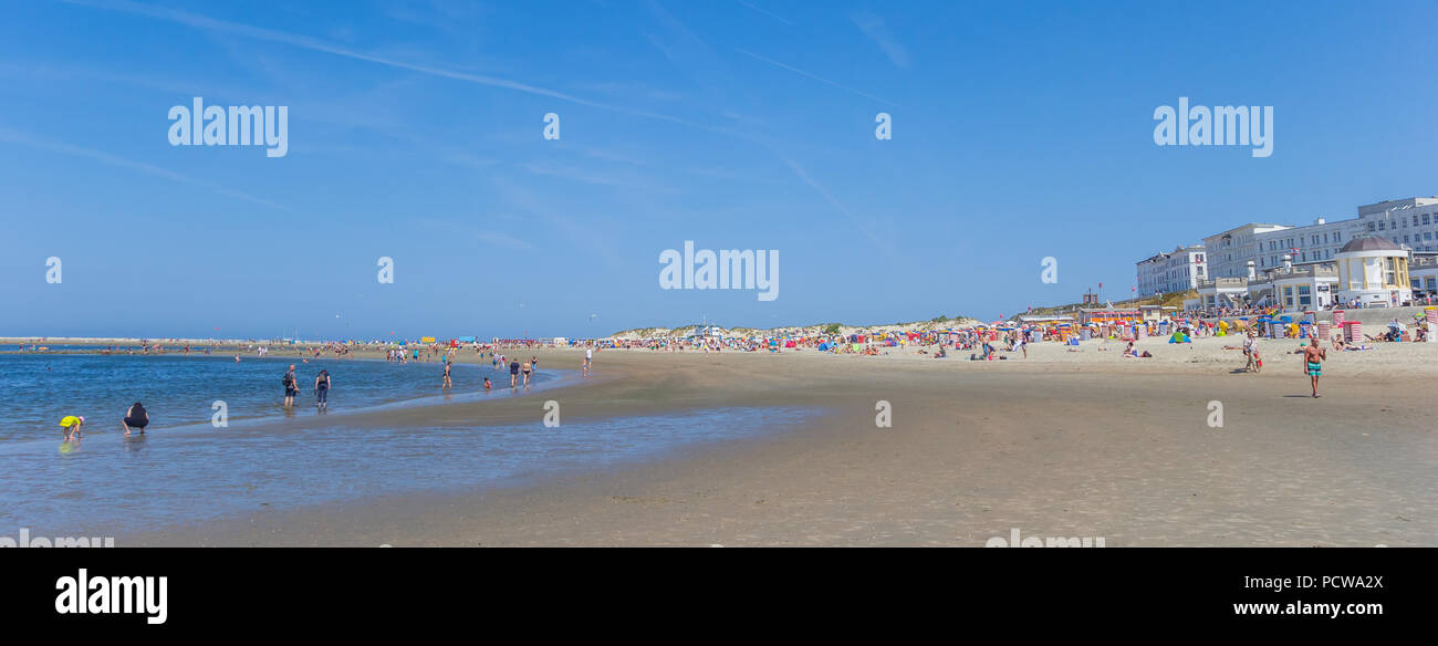 Panorama of people enjoying the beach on Borkum island in Germany Stock Photo