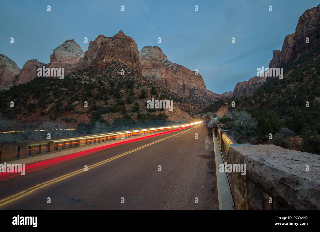 Headlight trails over Virgin Rive; scenic drive through Zion Canyon, which lets visitors explore Zion National Park near Springdale, Utah, by vehicle. Stock Photo