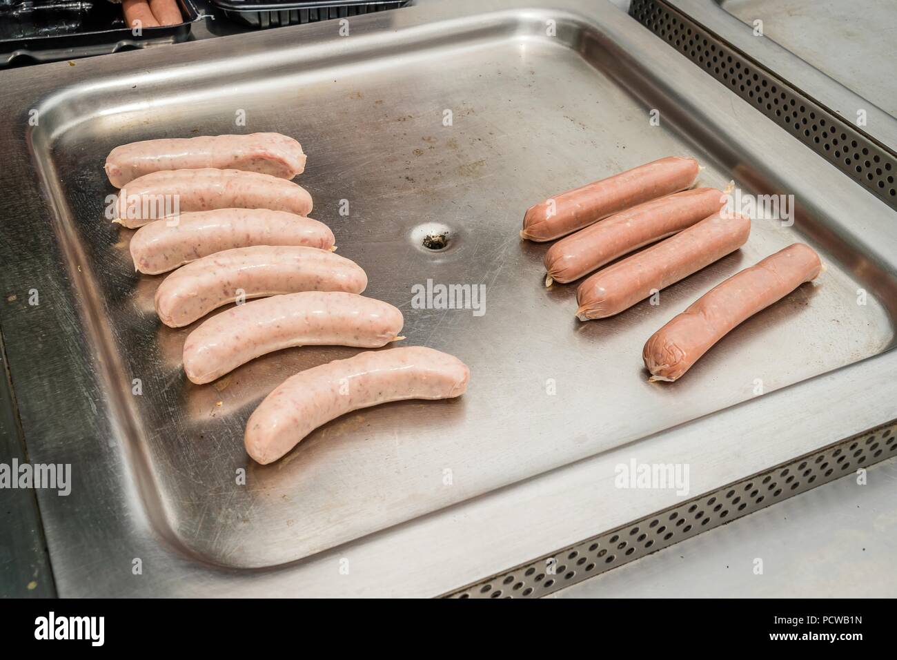 Public BBQ (barbecue) in Australia with sausages ready to be cooked