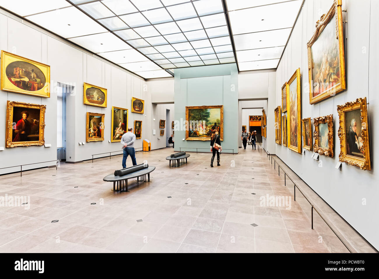 Interior of the Louvre art museum in Paris, France. Paintings from old