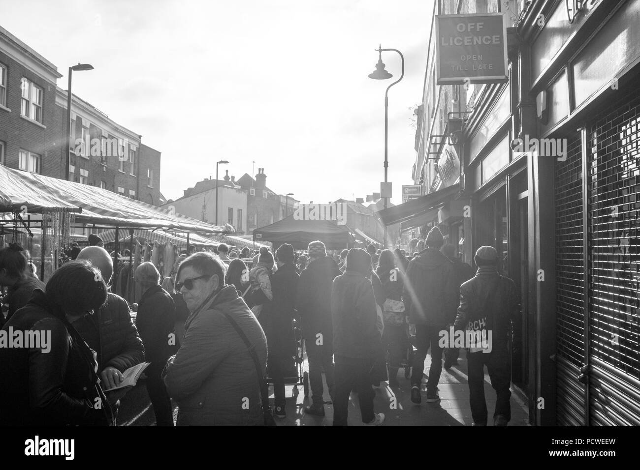 Popular Broadway Saturday market in the centre of Hackney, plenty of amazing food stalls, shops pubs and cafes. Black and white. London, England, UK. Stock Photo