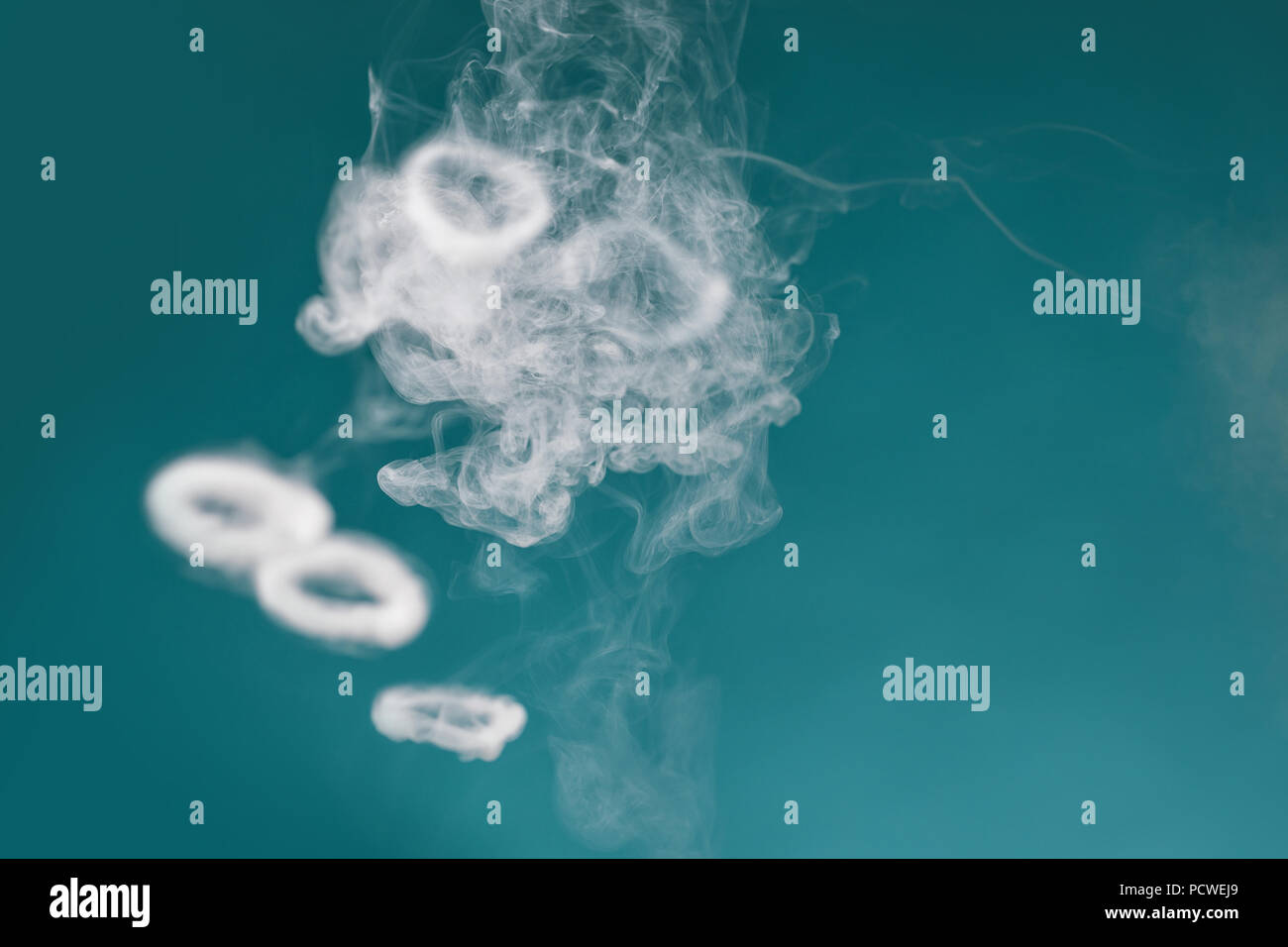 white smoke on a blue background Stock Photo Alamy