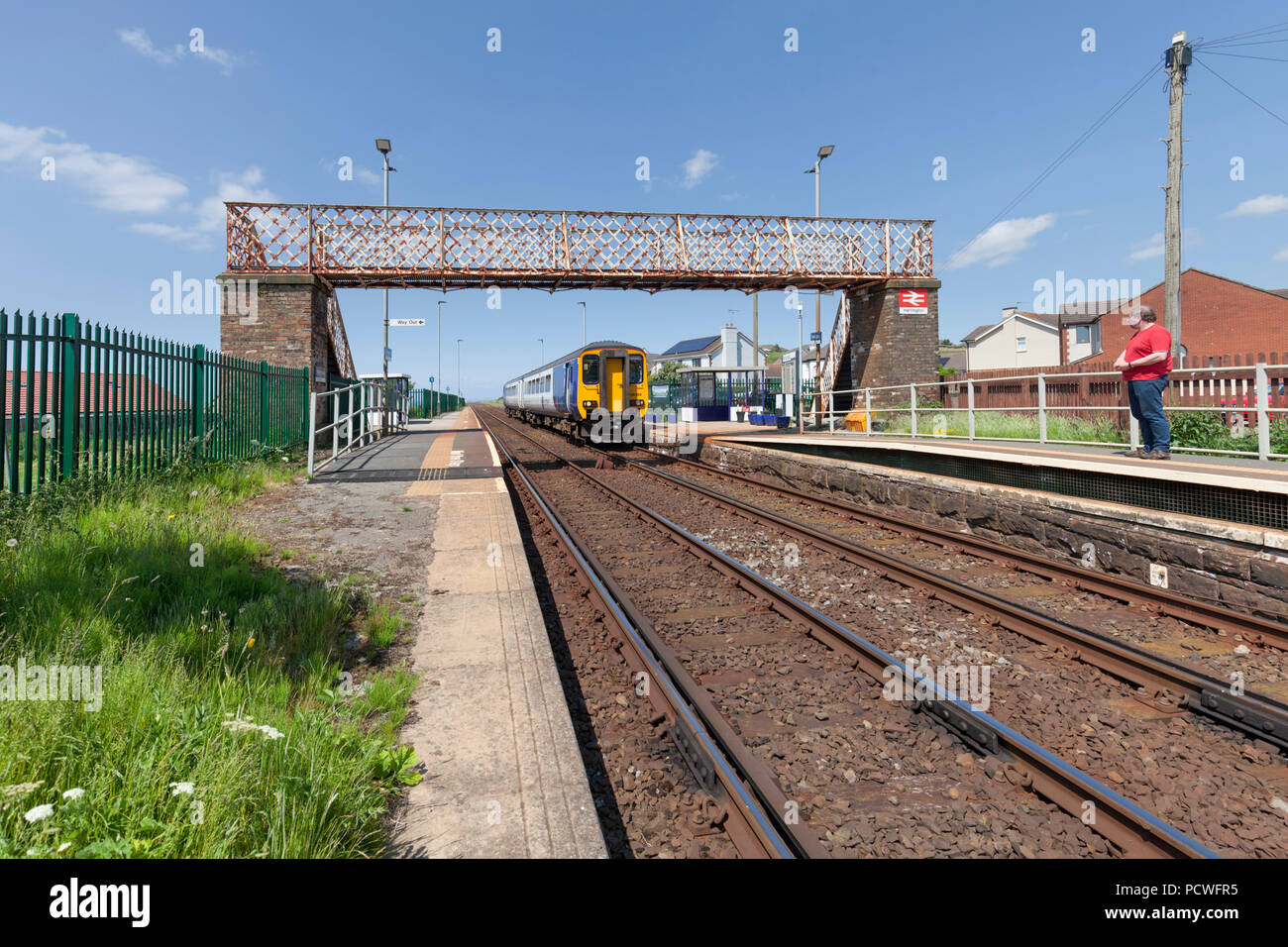 A Northern rail class 156 sprinter train at Harrington railway station on  the Cumbrian coast railway line with a Carlisle to Barrow in Furness train  Stock Photo - Alamy