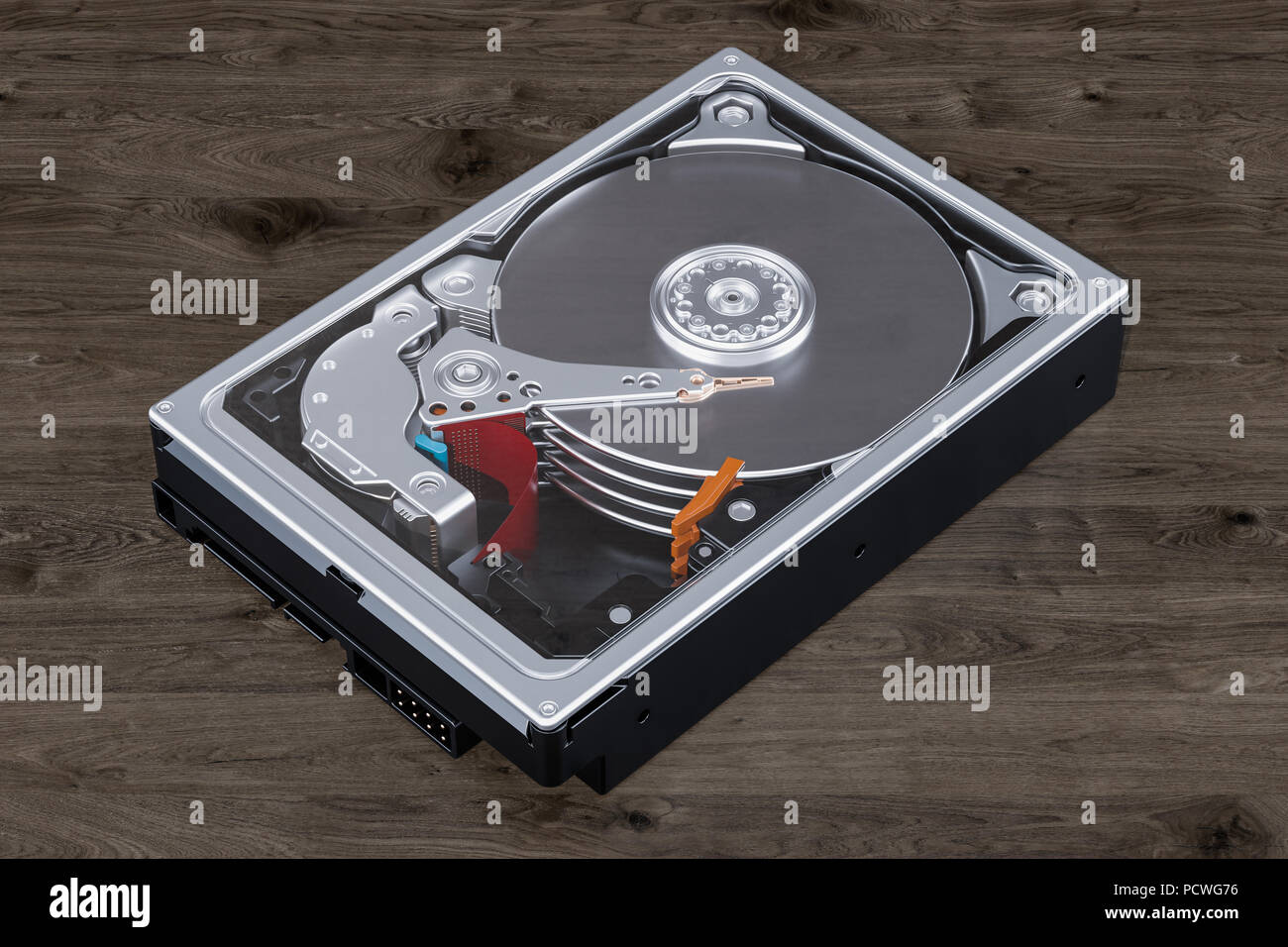 Hard Disk Drive (HDD) on the wooden background, 3D rendering Stock Photo