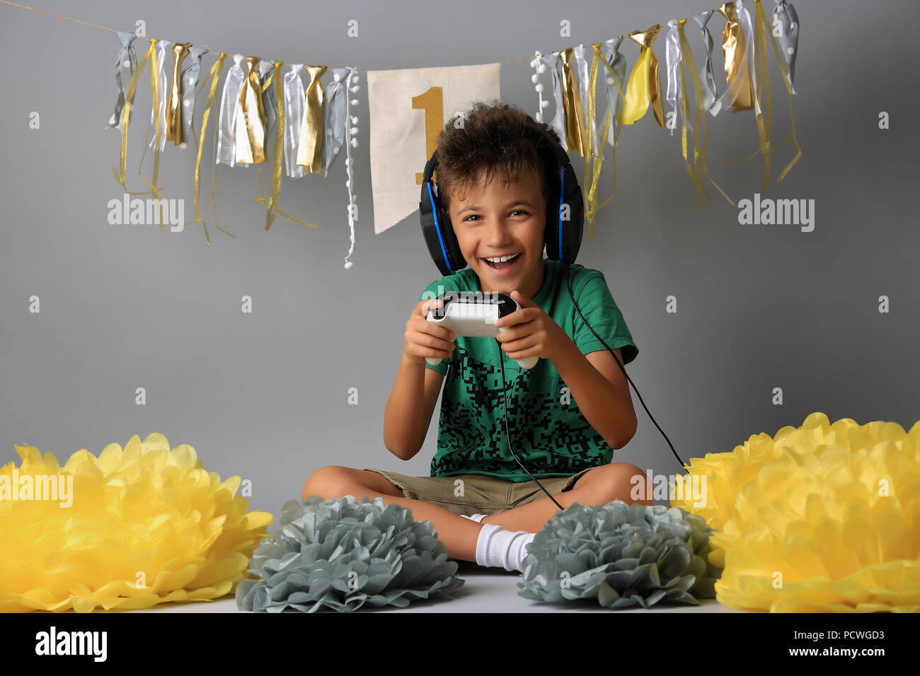 Cute boy playing video games Stock Photo