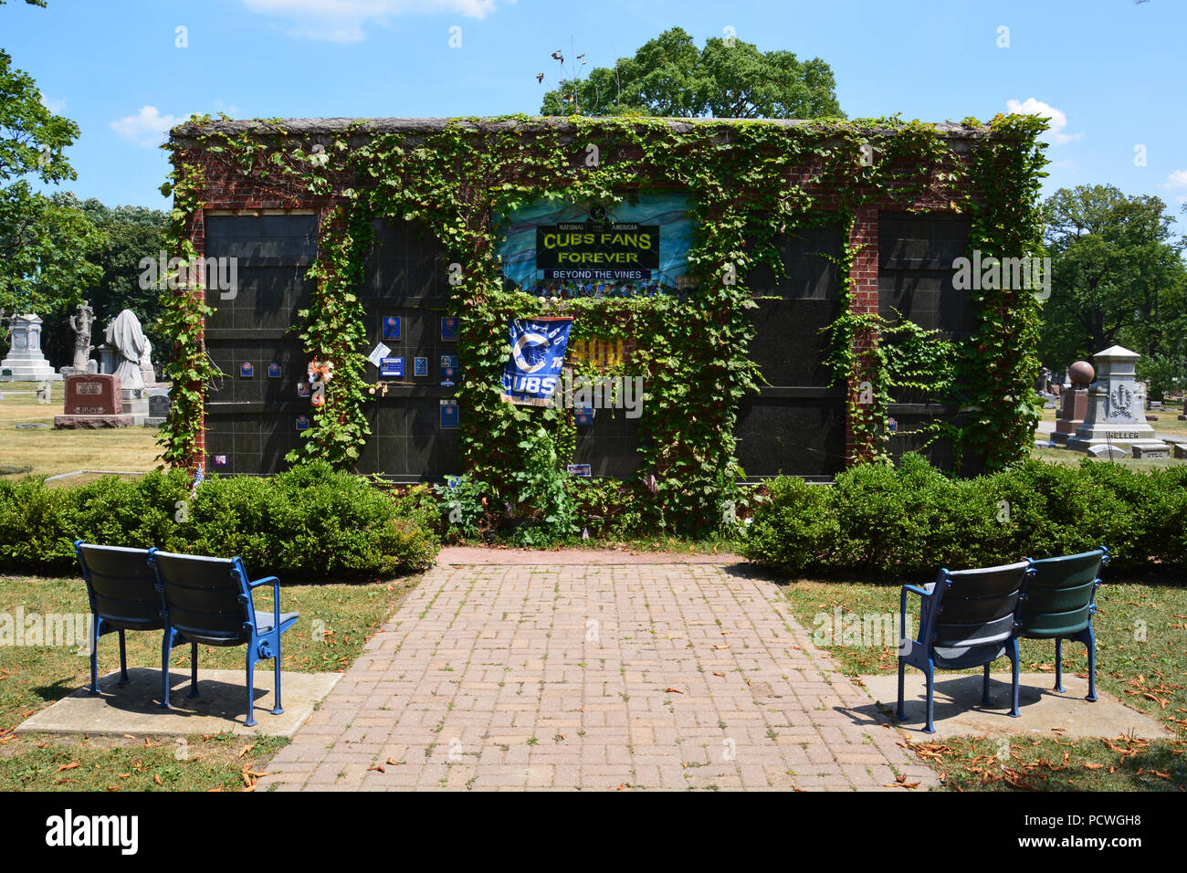 Beyond The Vines is a Chicago Cubs themed columbarium where fans can be interned in a brick outfield wall with ivy and seats from Wrigley Field Stock Photo