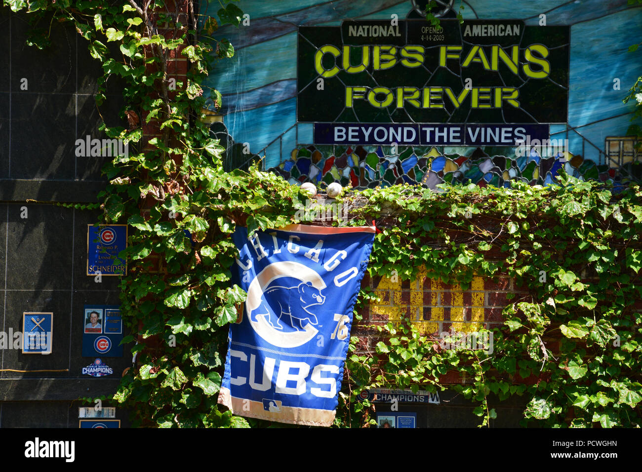 Beyond The Vines is a Chicago Cubs themed columbarium where fans can be interned in a brick outfield wall with ivy and seats from Wrigley Field Stock Photo