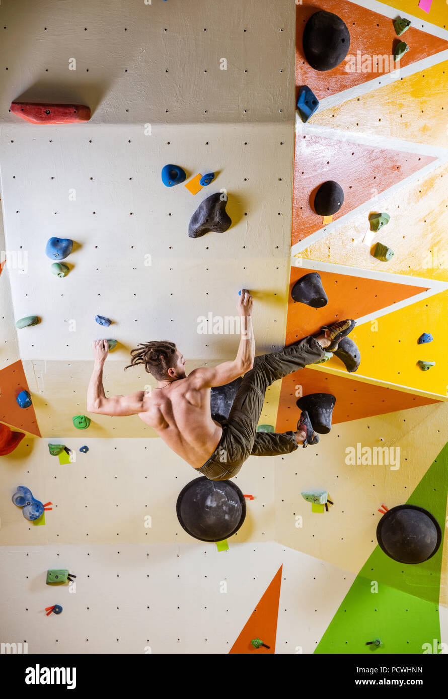 Man climbing indoor wall hi-res stock photography and images - Alamy