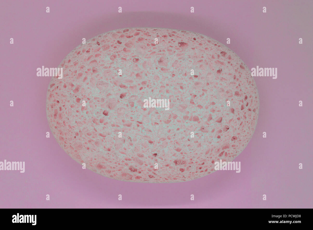 Abstract composition of pink sponge on pink background surface Stock Photo