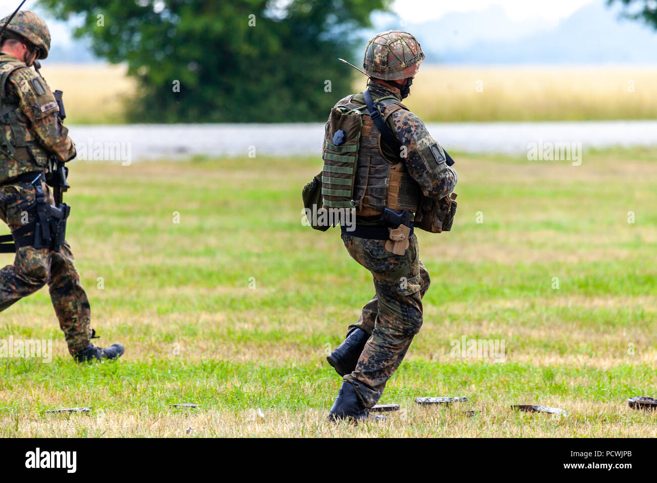 FELDKIRCHEN / GERMANY - JUNE 9, 2018: German soldier on an exercise at open day on day of the Bundeswehr in Feldkirchen Stock Photo