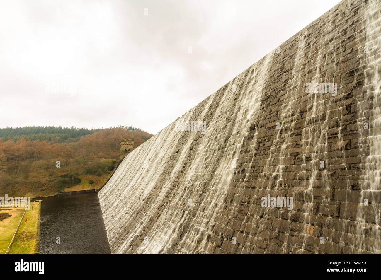 Water cascades down the Derwent Dam, Ladybower reservoir. Near