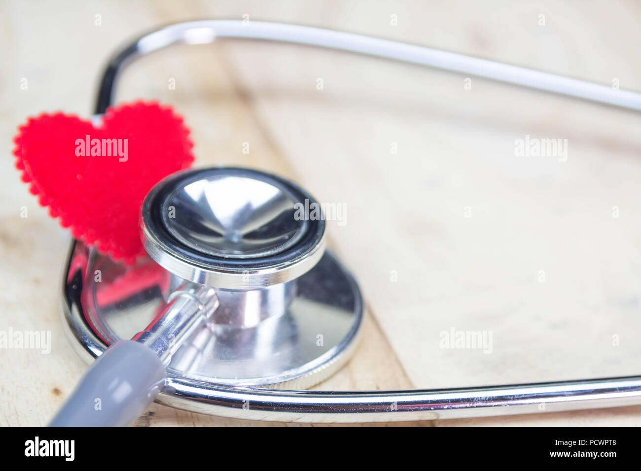 stethoscope put on wooden background with heart red color Stock Photo ...