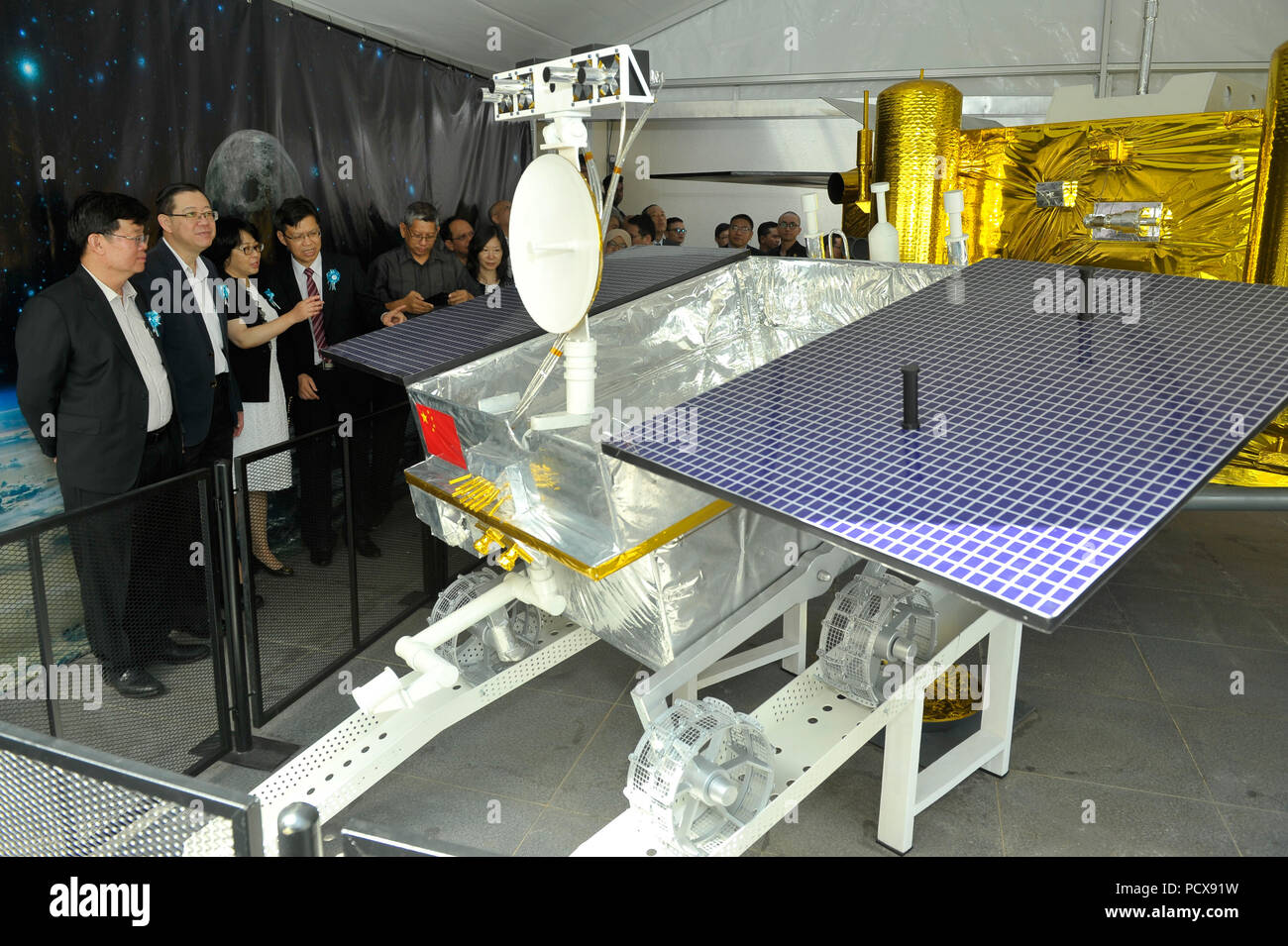 Penang. 4th Aug, 2018. People look at China's Yutu lunar rover model at ...