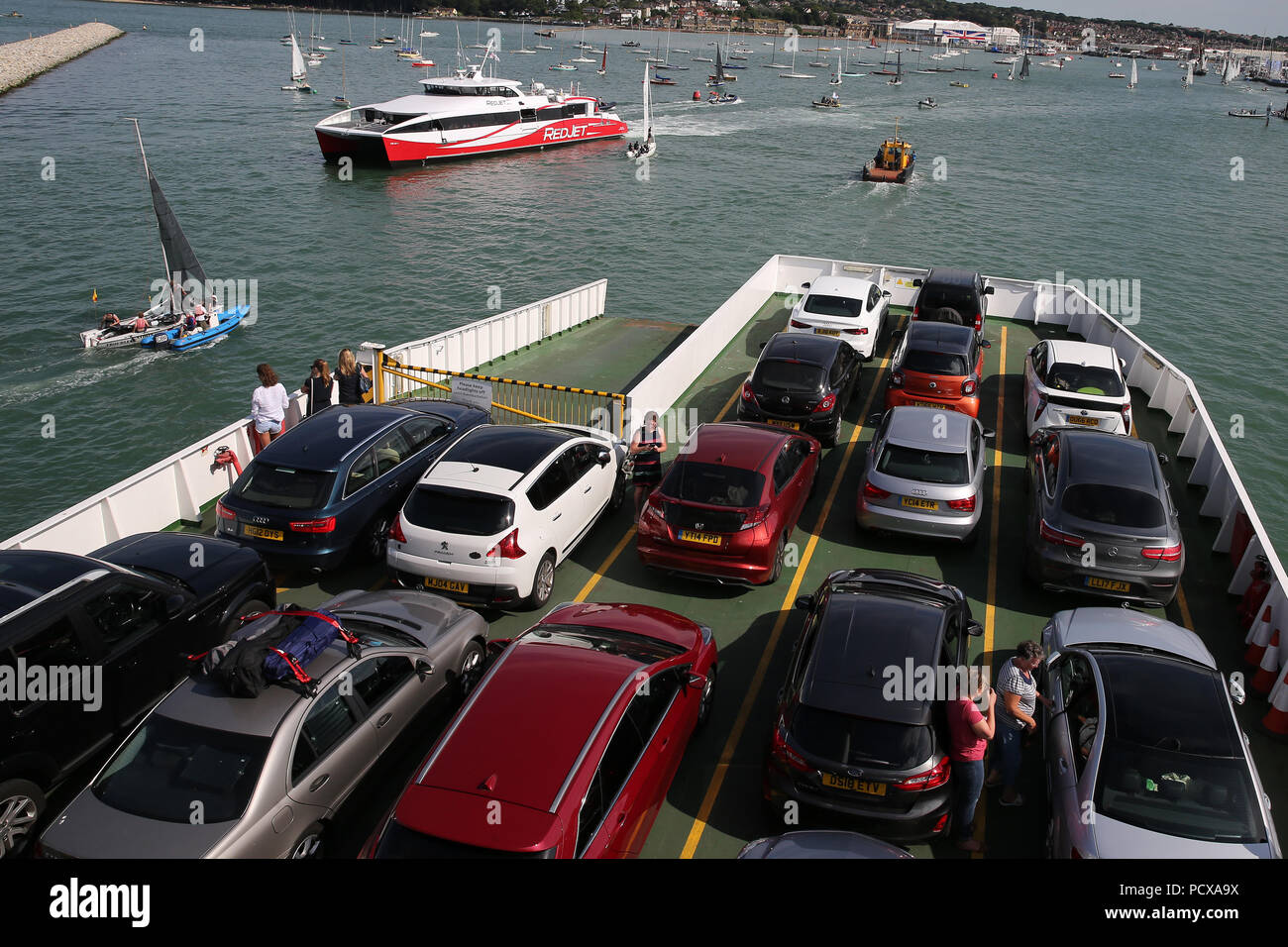 holiday makers return to their cars on a Red Funnel ferry on the Solent, as they approach the