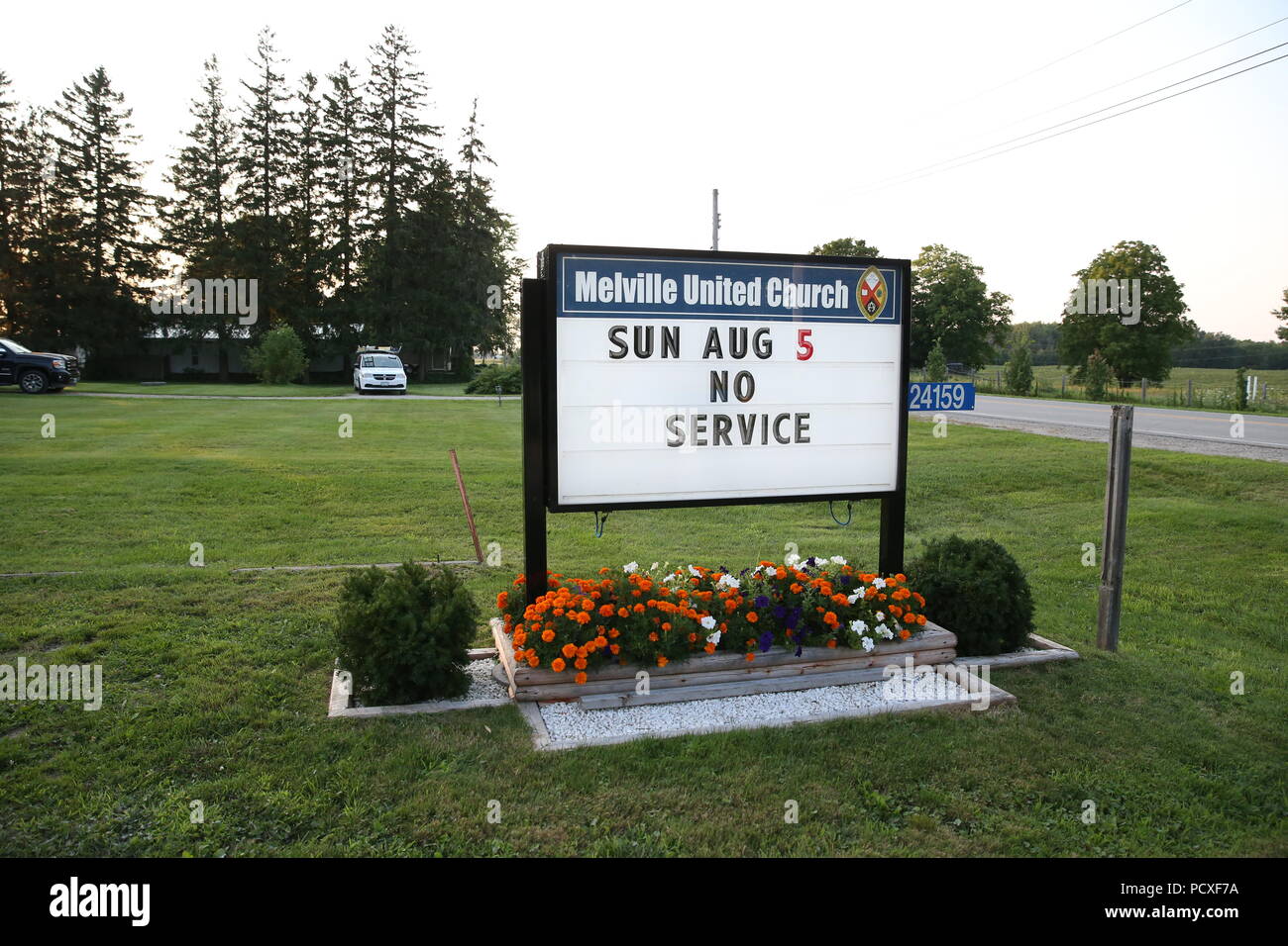 Ontario, Canada. 4 August2018. No one could tell you when the last time Sunday service was cancelled at Melville United Church in Lobo. Due to the Cycling event at 2018 Ontario summer games the mass was cancelled on Sunday Aug 5 2018,  The finish line is right in front of the church on Nairn Rd. The church is also being used as a location to feed the athletes and volunteers of the games.  “The congregation voted unanimously to close the church for the day. This was decided to support the Ontario Summer Games, our young athletes, and because we saw it as an opportunity for community outreach, O Stock Photo