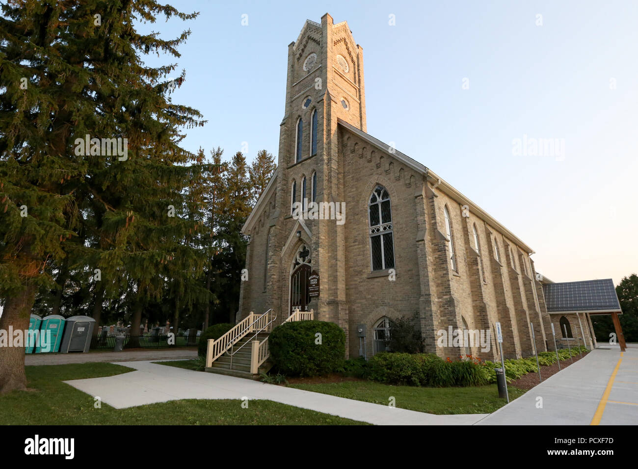 Ontario, Canada. 4 August2018. No one could tell you when the last time Sunday service was cancelled at Melville United Church in Lobo. Due to the Cycling event at 2018 Ontario summer games the mass was cancelled on Sunday Aug 5 2018,  The finish line is right in front of the church on Nairn Rd. The church is also being used as a location to feed the athletes and volunteers of the games.  “The congregation voted unanimously to close the church for the day. This was decided to support the Ontario Summer Games, our young athletes, and because we saw it as an opportunity for community outreach, O Stock Photo