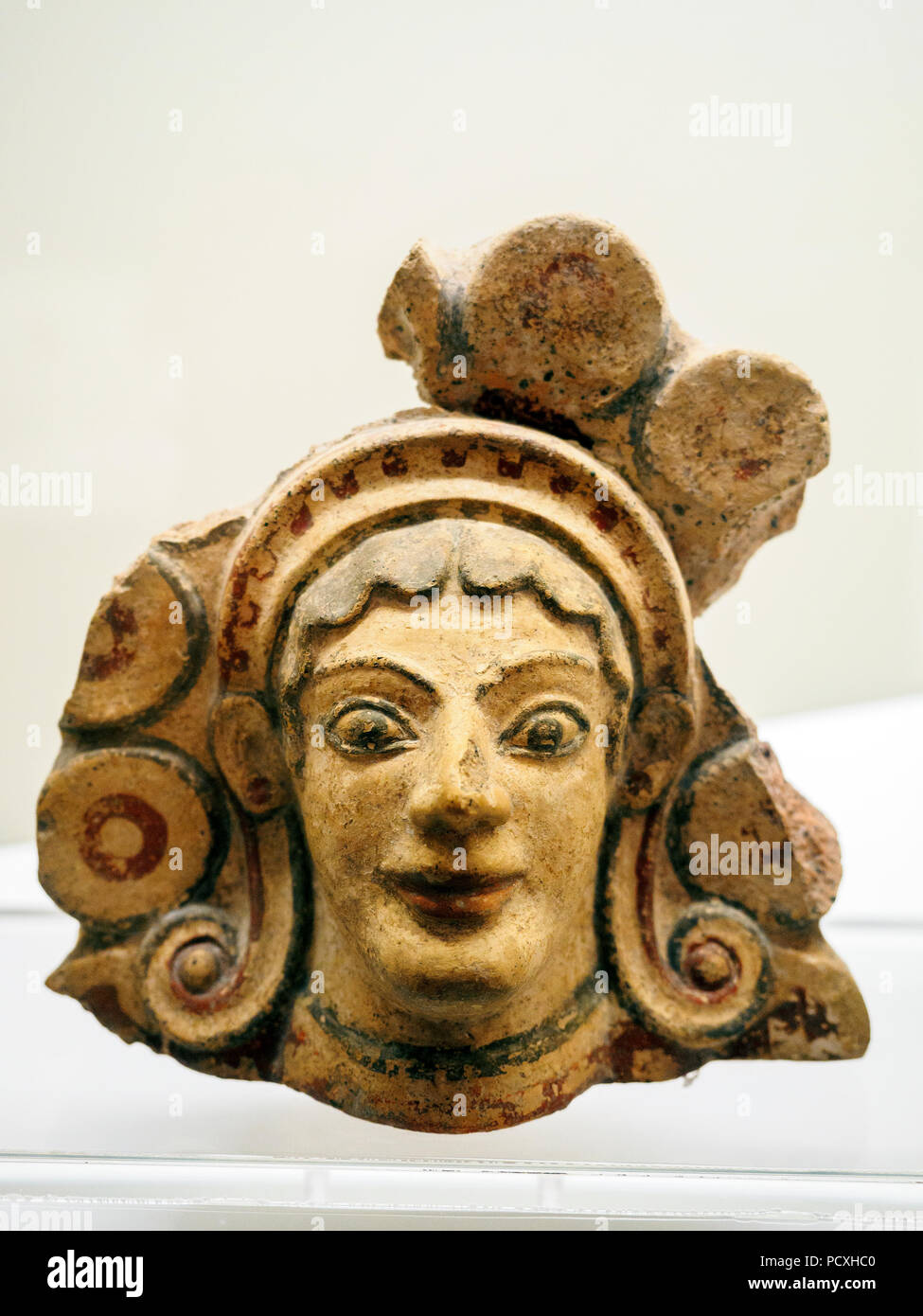 Antefixes with head of Maenad within a crown of rosettes or disks from the Sanctuary of the Acropolis of Vignale (5th-2nd century BC) - National Etruscan Museum of Villa Giulia - Rome, Italy Stock Photo