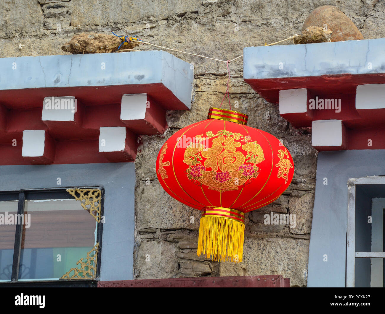 Daocheng, China - Aug 15, 2016. A red lantern for decoration at traditional house in Daocheng, China. Stock Photo