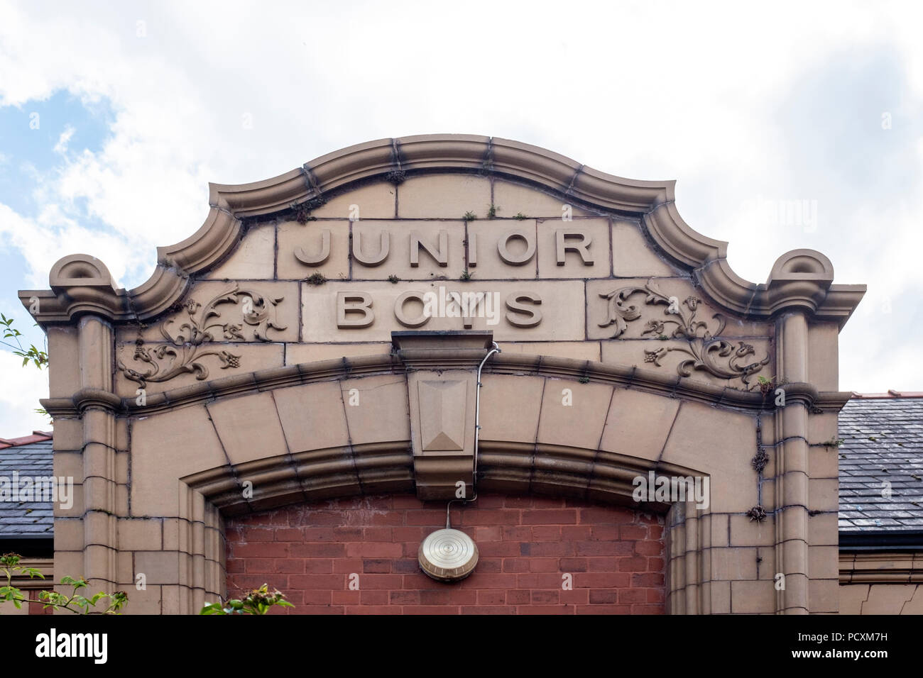 Junior boys sign above Victorian school entrance in Middlewich Cheshire UK Stock Photo