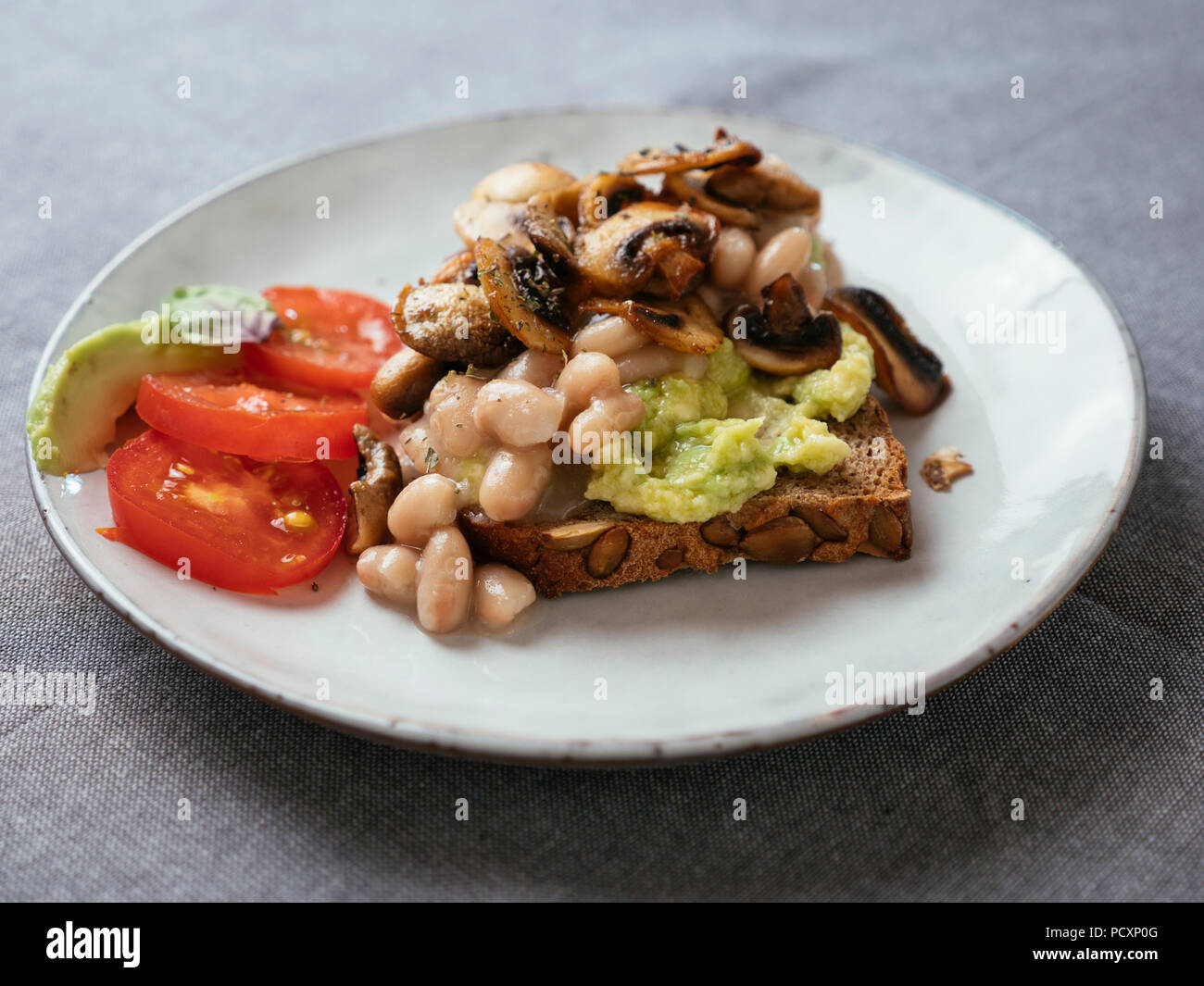 Avocado Toast with White Beans and Mushrooms Stock Photo Alamy